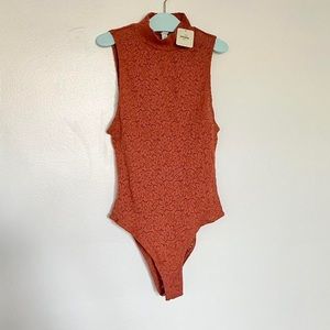 New with tags Free People burnt orange mock neck lace bodysuit